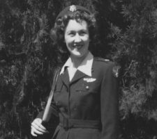 In 1944, Nadine sports the newly-designed Santiago blue WASP uniform adopted in spring 1944 to differentiate U.S. Army Air Force personnel from the Army’s standard green uniforms.