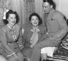 A family reunited in 1945: Following the war, Ed returned to the U.S. after three years behind enemy lines – and listed as Missing in Action; Nadine flew him from California to Kansas for a reunion in Nelle’s Wichita home.